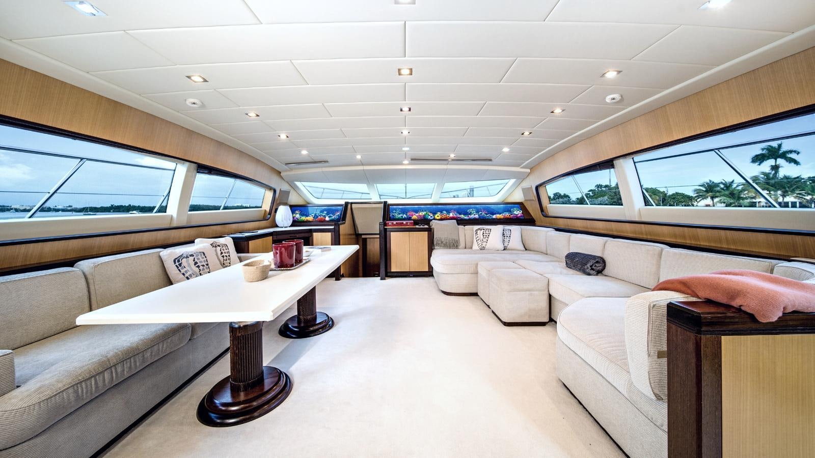 a room with couches and tables aboard DAYA Yacht for Sale