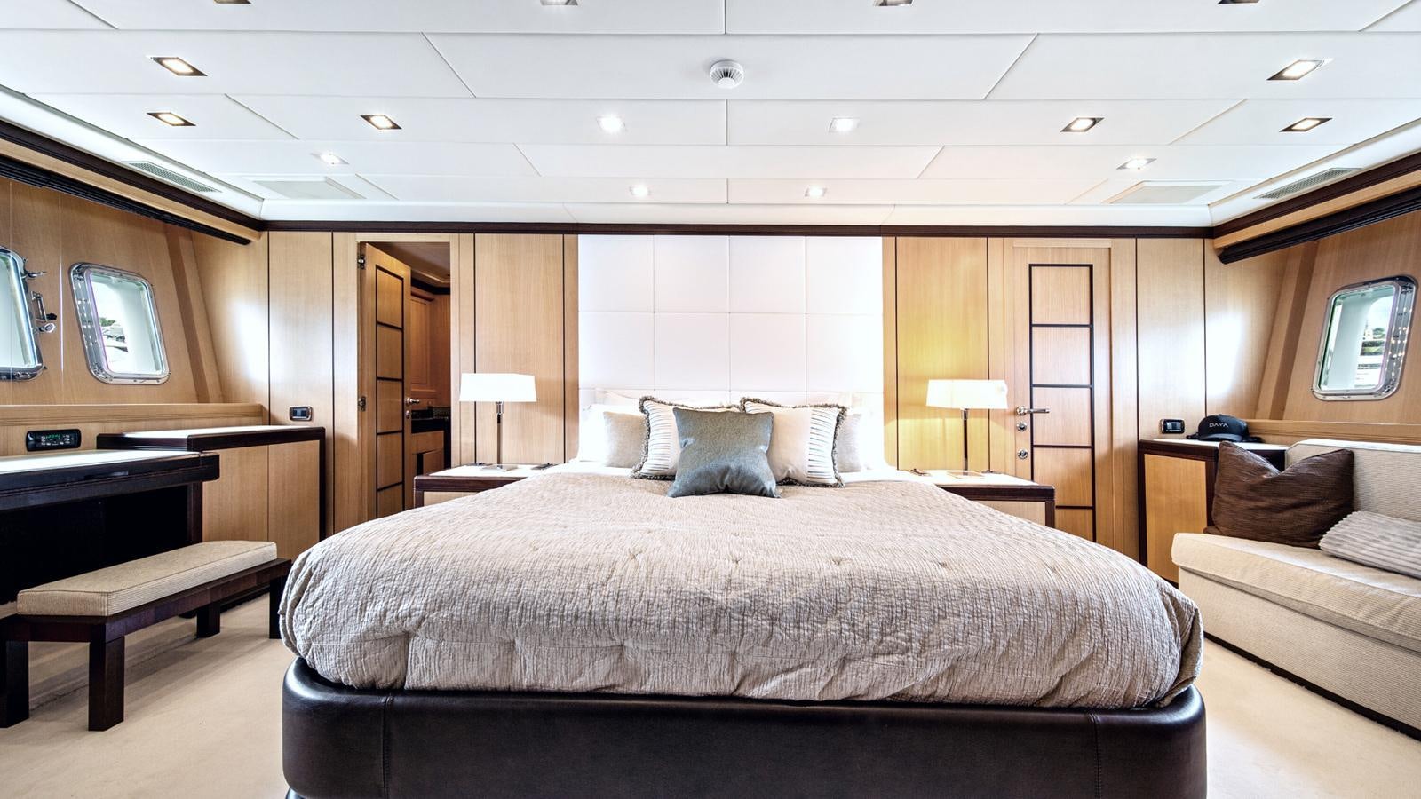 a large bed in a hotel room aboard DAYA Yacht for Sale