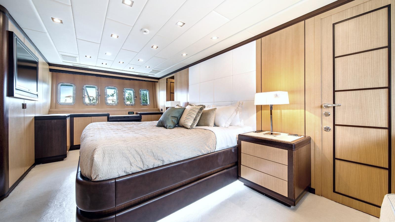 a room with a bed and a desk aboard DAYA Yacht for Sale