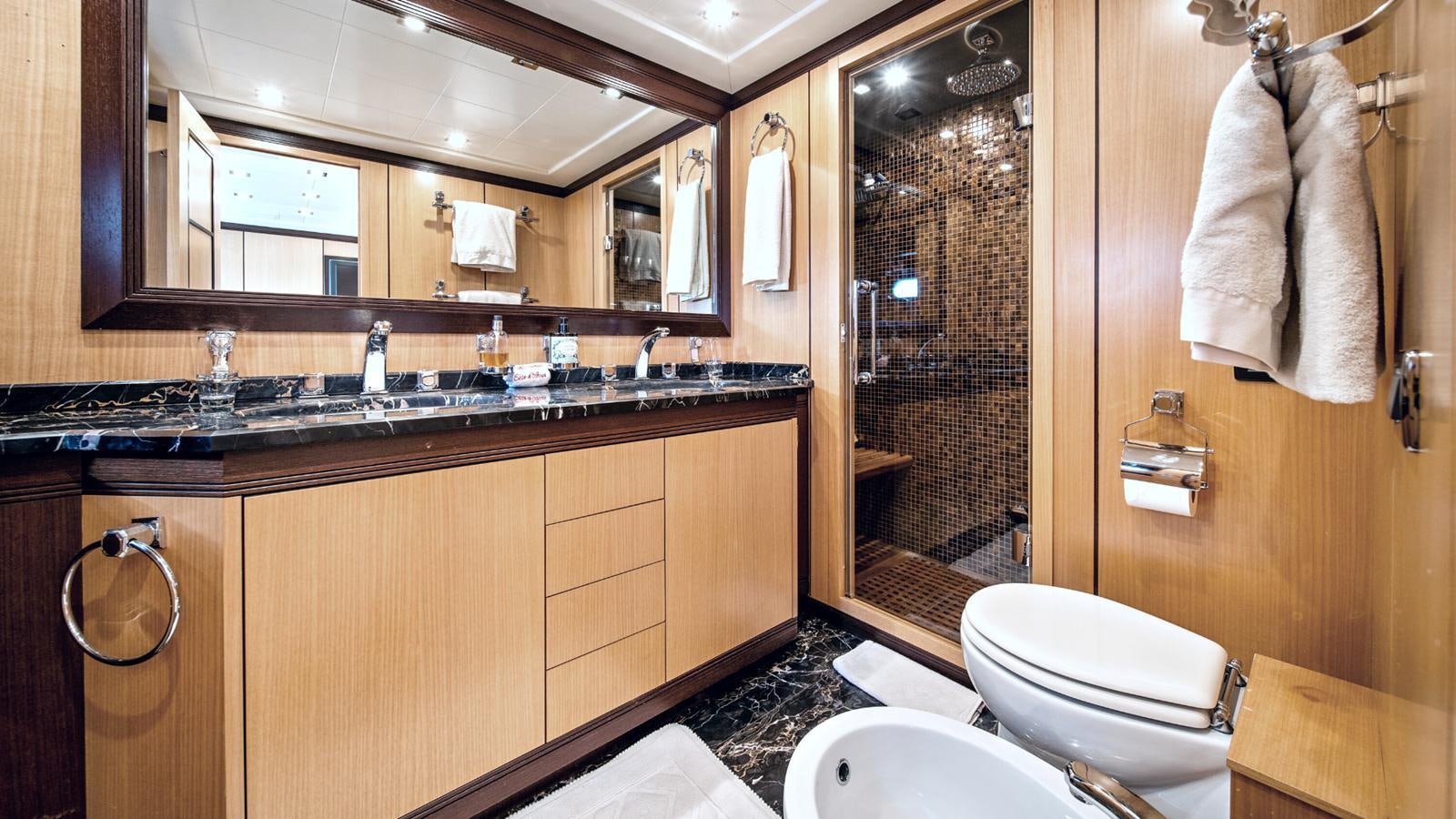 a bathroom with a large mirror aboard DAYA Yacht for Sale