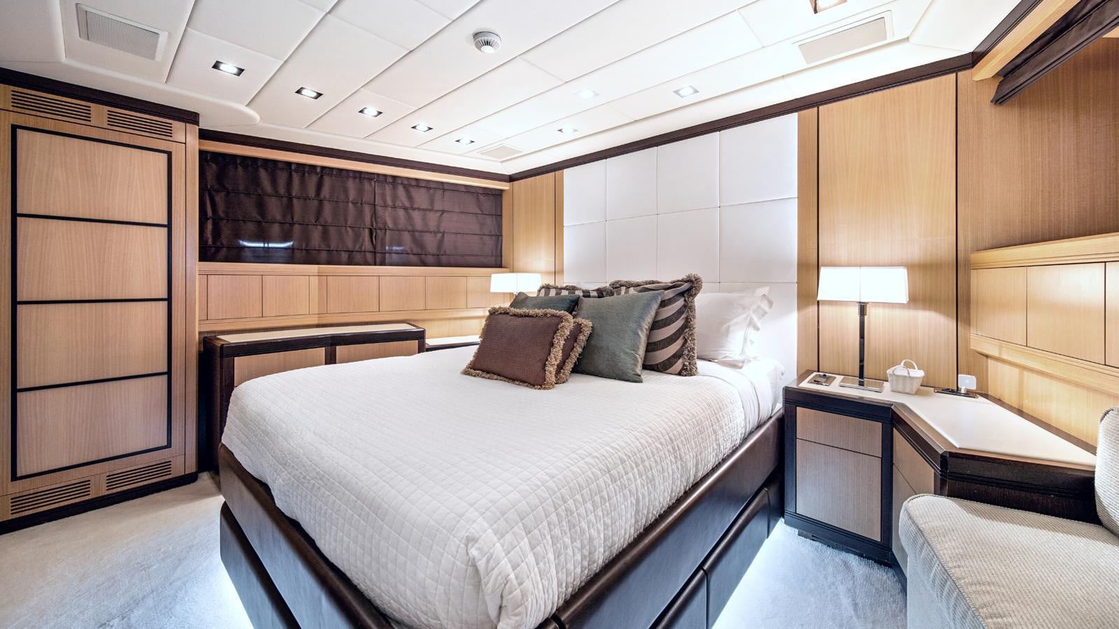 a room with a bed and a desk aboard DAYA Yacht for Sale