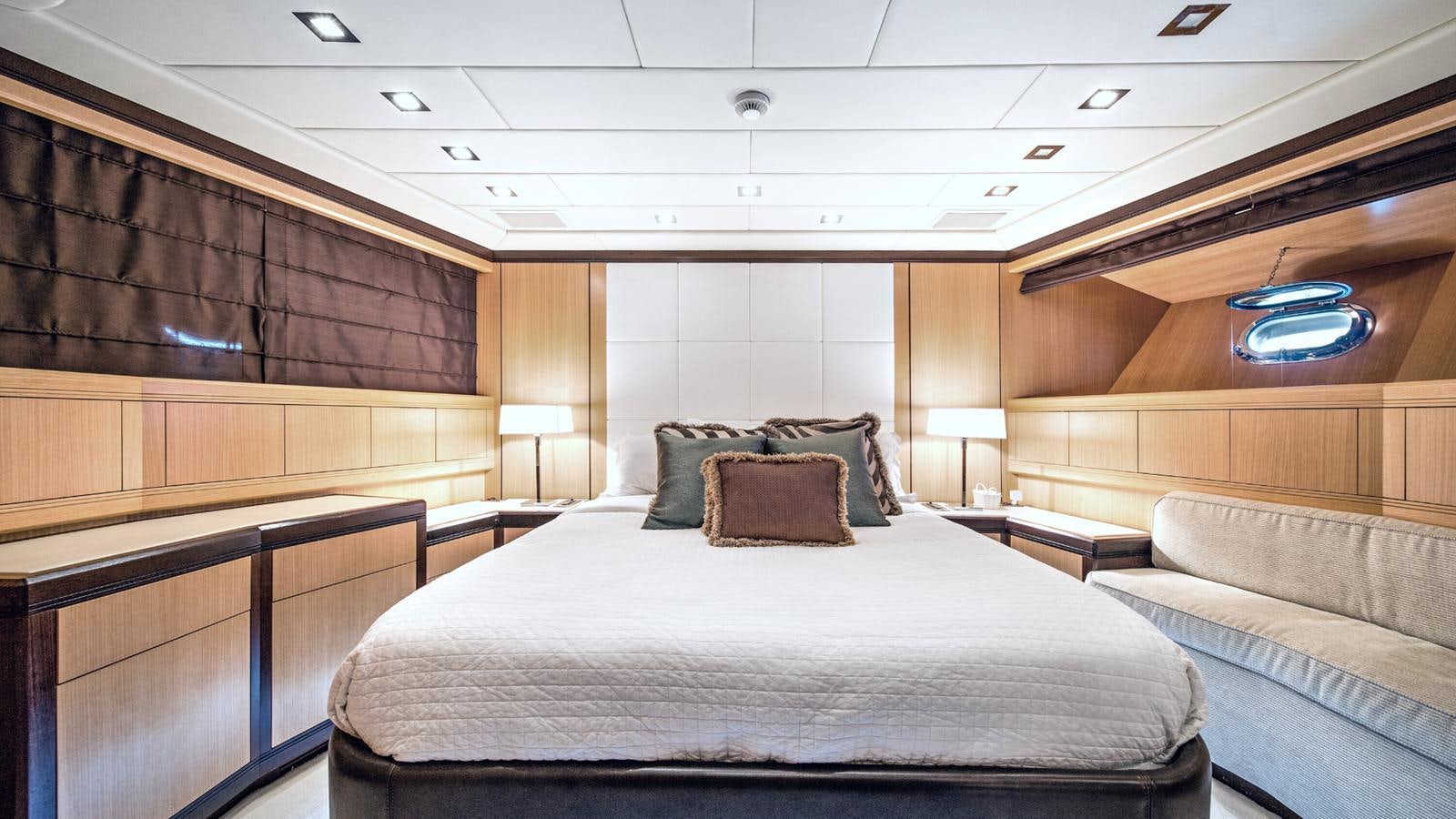 a room with a bed and a couch aboard DAYA Yacht for Sale