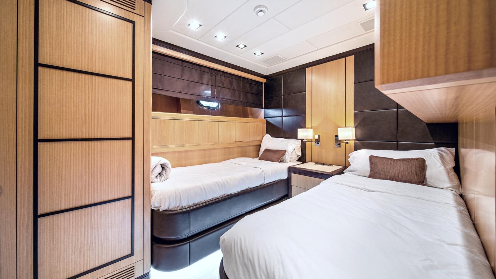 a room with two beds aboard DAYA Yacht for Sale