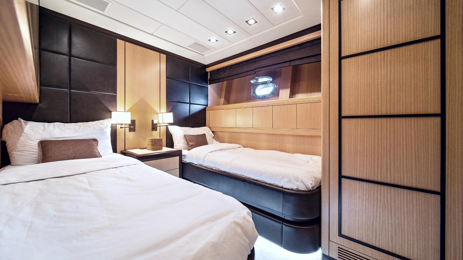 a room with two beds aboard DAYA Yacht for Sale