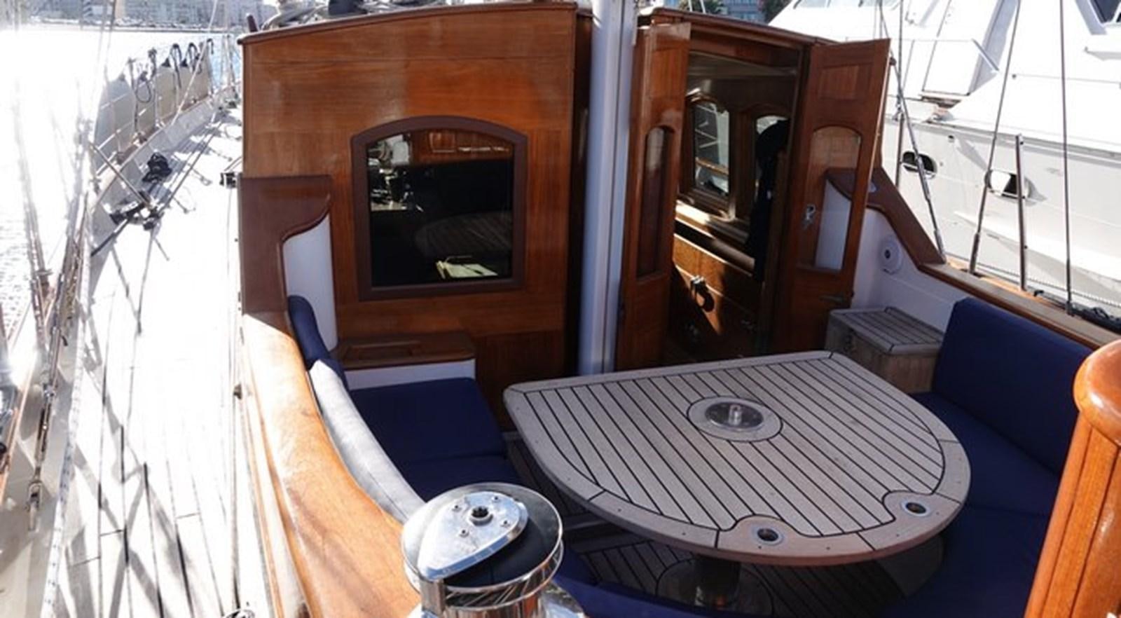 a room with a table and a mirror aboard WINDWEAVER OF PENNINGTON Yacht for Sale