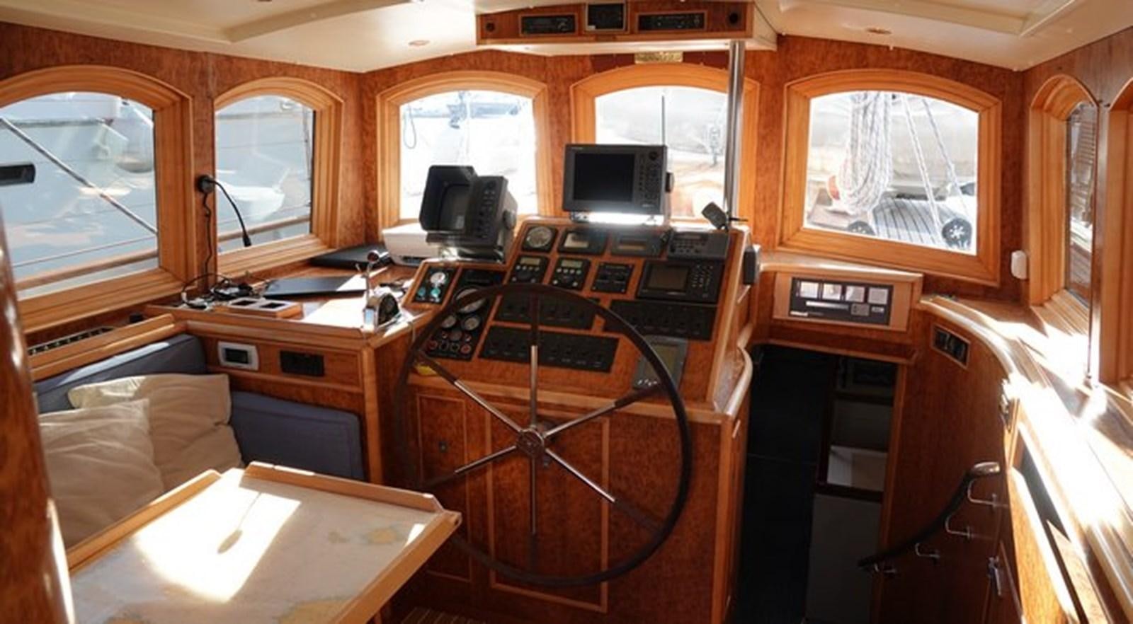 a room with a desk and a bed aboard WINDWEAVER OF PENNINGTON Yacht for Sale