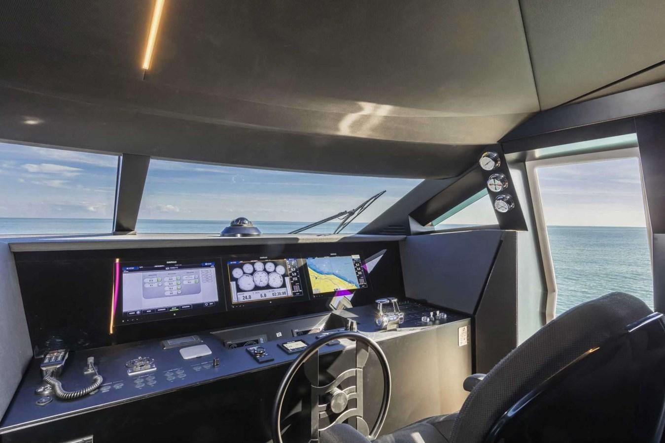 a cockpit with a desk and monitors aboard LADY G Yacht for Sale
