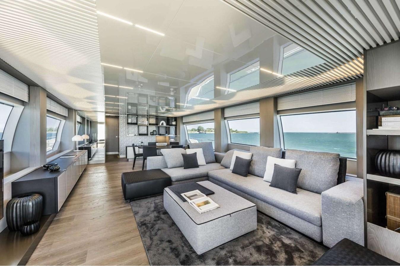 a living room with a large window aboard LADY G Yacht for Sale