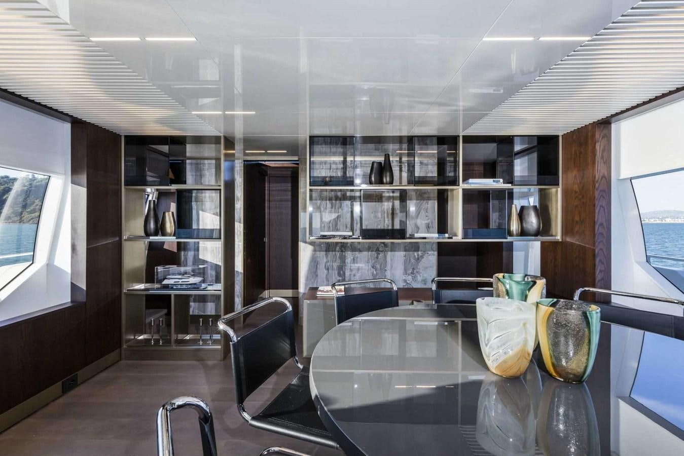 a room with a table and chairs aboard LADY G Yacht for Sale