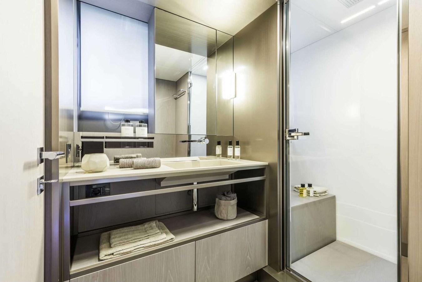 a bathroom with a large mirror aboard LADY G Yacht for Sale