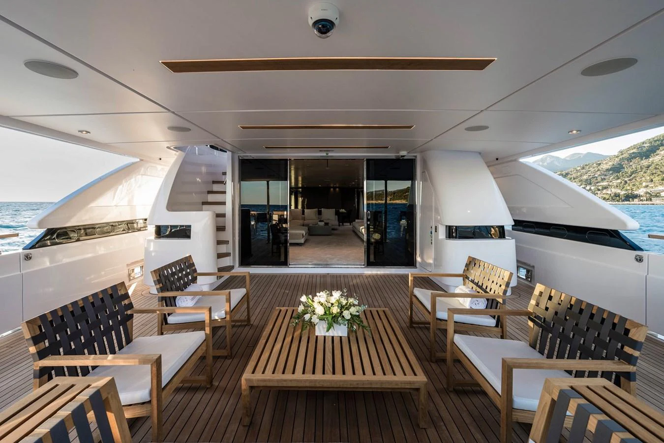 a room with tables and chairs aboard REGINA Yacht for Sale