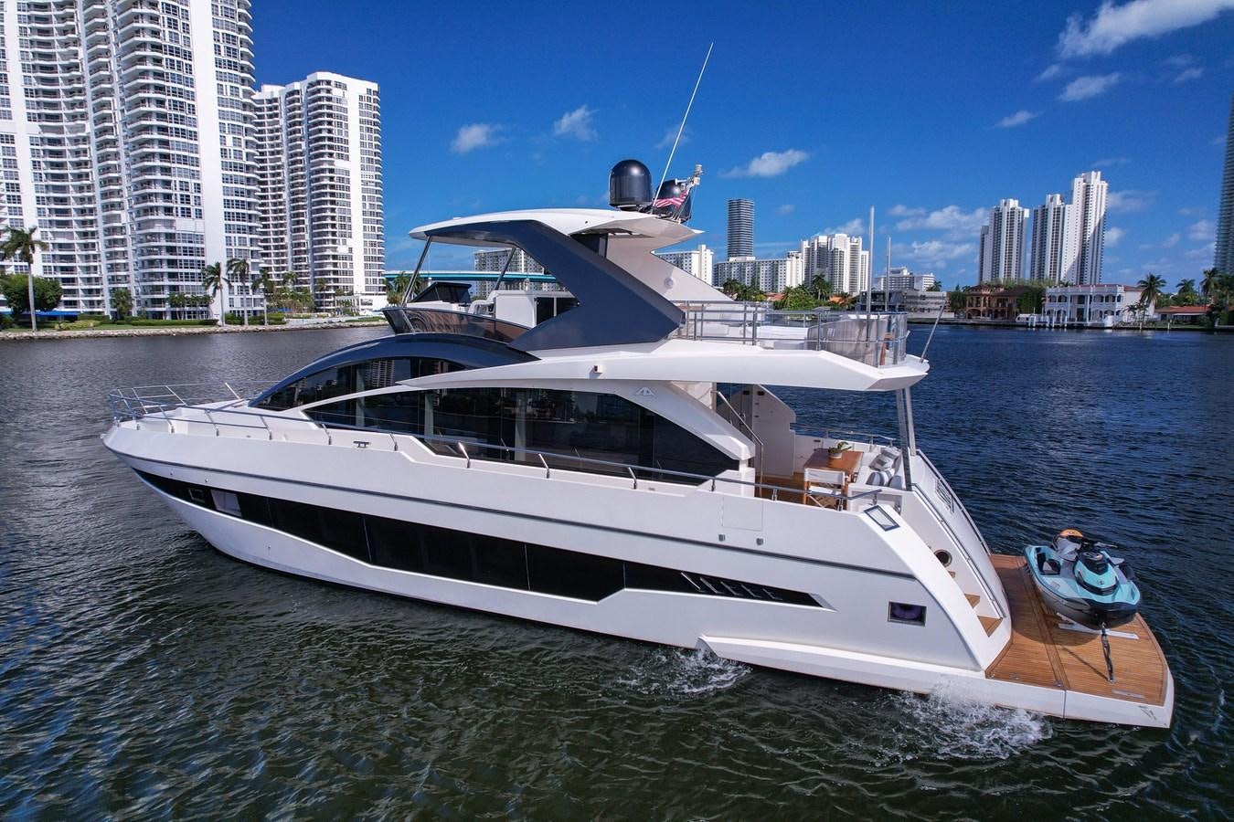 a white boat on the water aboard SHEVA Yacht for Sale