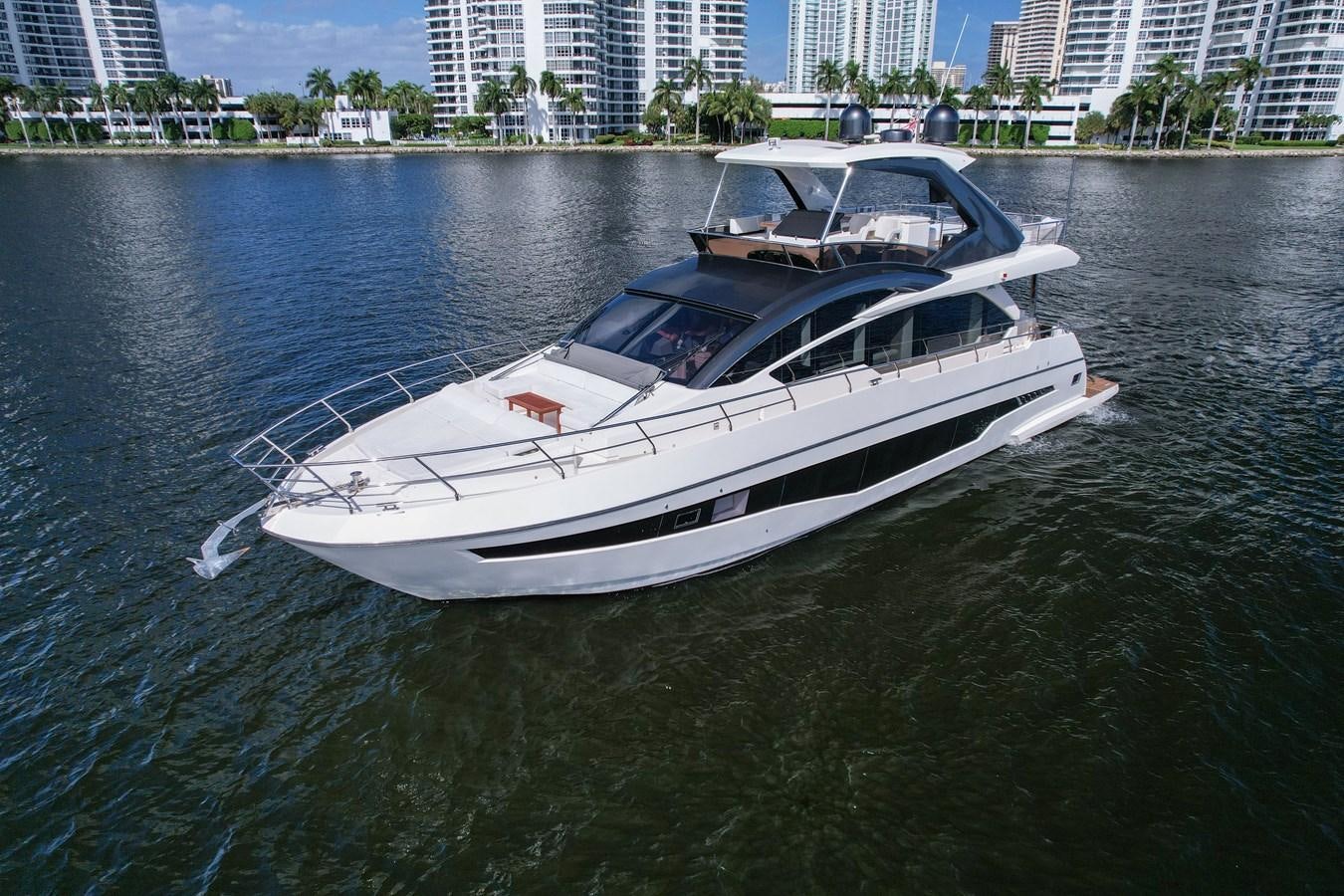 a white boat in the water aboard SHEVA Yacht for Sale