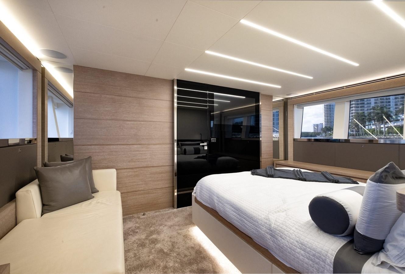 a room with a bed and a couch aboard SHEVA Yacht for Sale