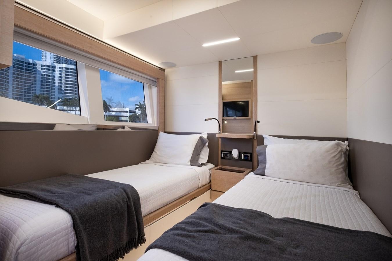 a couple of beds in a room aboard SHEVA Yacht for Sale