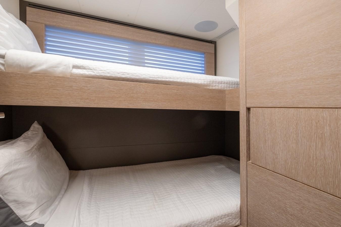 a bed with a white comforter aboard SHEVA Yacht for Sale