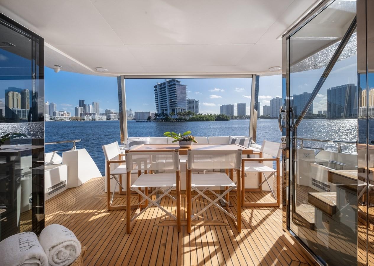 a room with a table and chairs aboard SHEVA Yacht for Sale