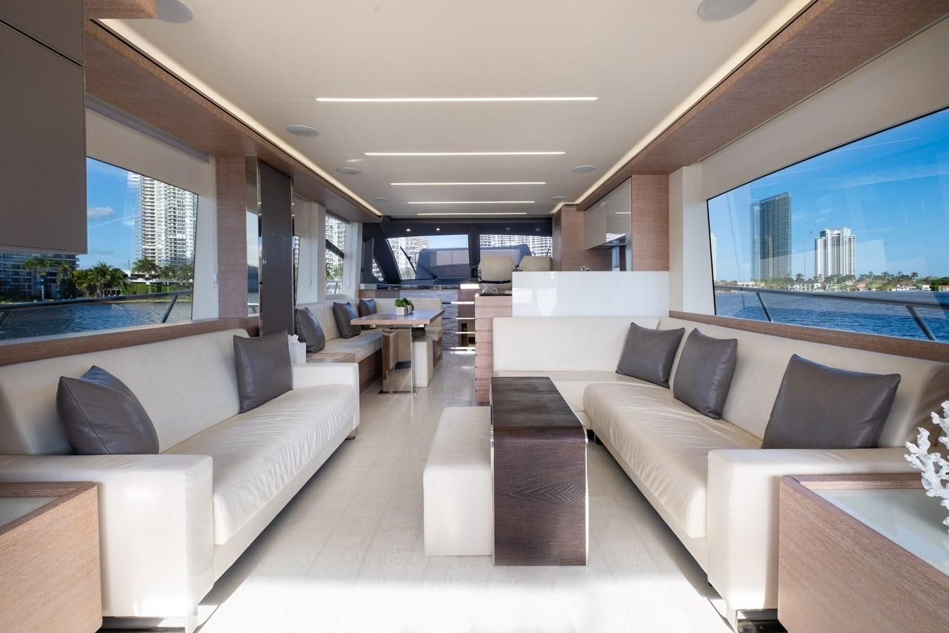 a living room with a large window aboard SHEVA Yacht for Sale