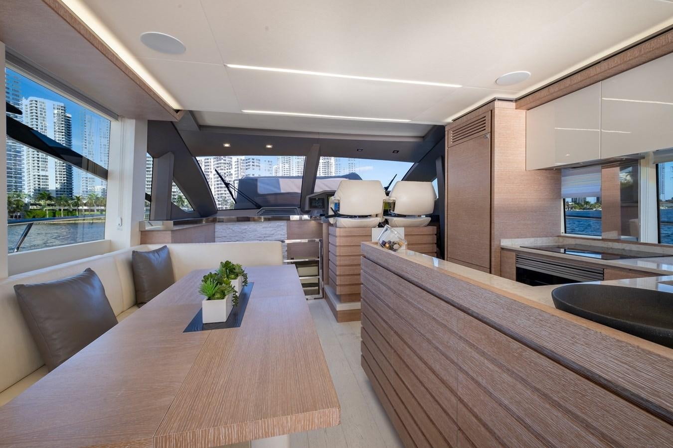 a large open kitchen and dining area aboard SHEVA Yacht for Sale