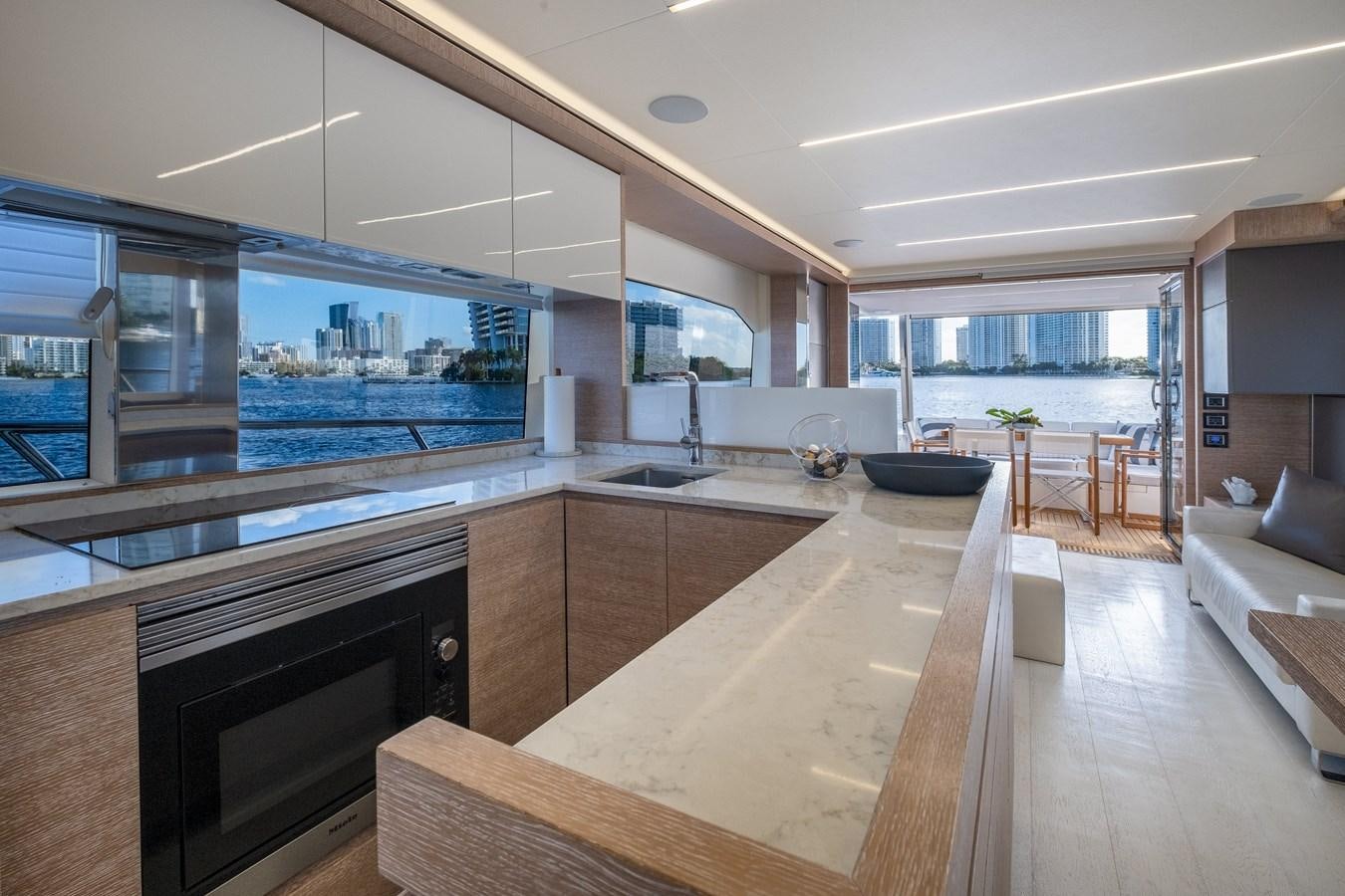 a kitchen with a large window aboard SHEVA Yacht for Sale