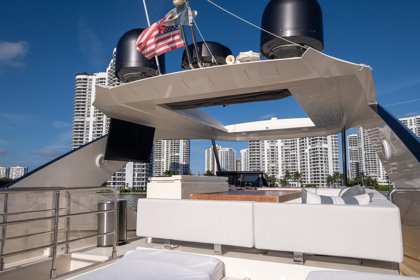 a large white building with a flag on top aboard SHEVA Yacht for Sale