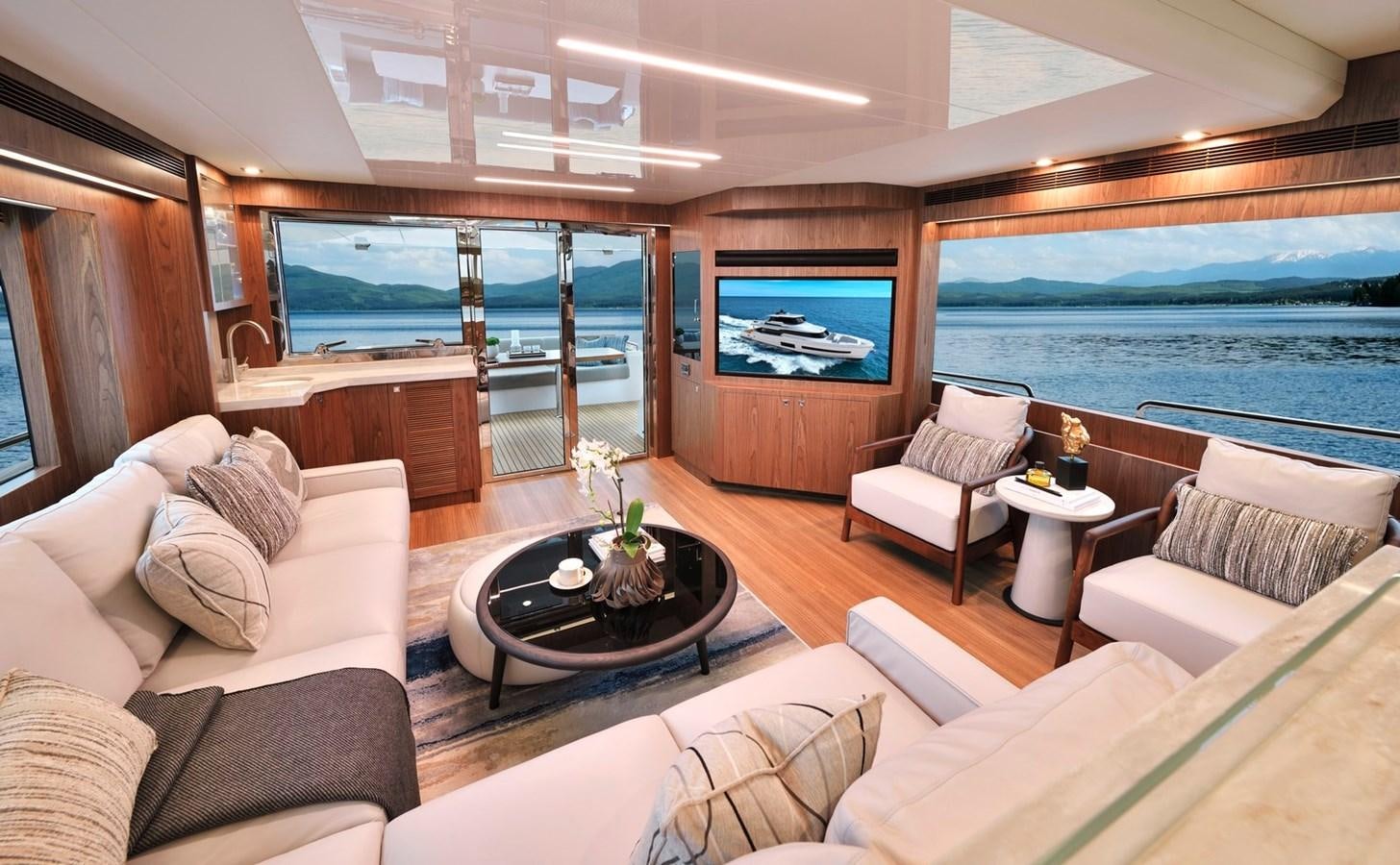 a living room with a large window aboard HORIZON V77 CMY / AVAILABLE NOW Yacht for Sale