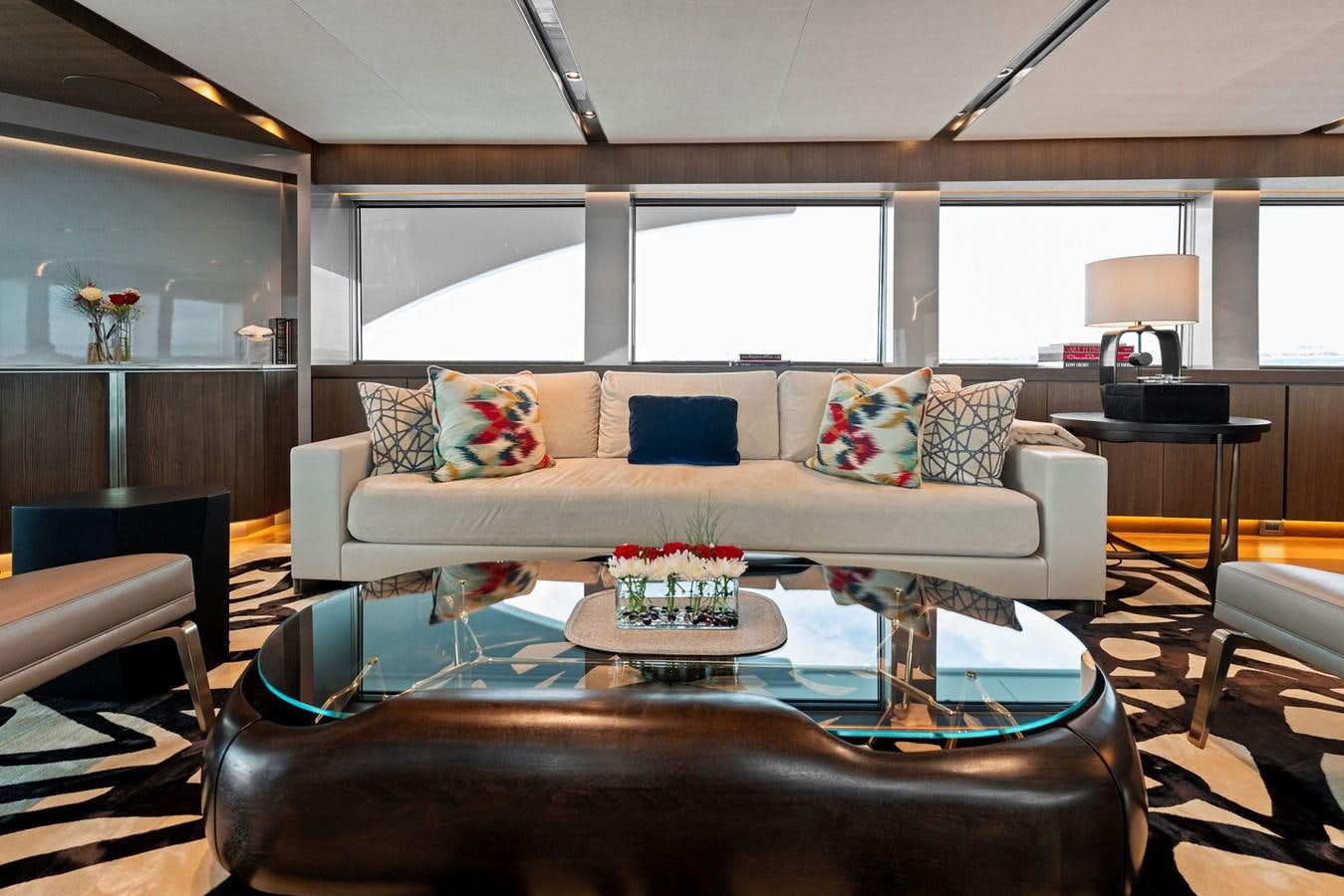 a living room with a large window aboard SERENITY Yacht for Sale