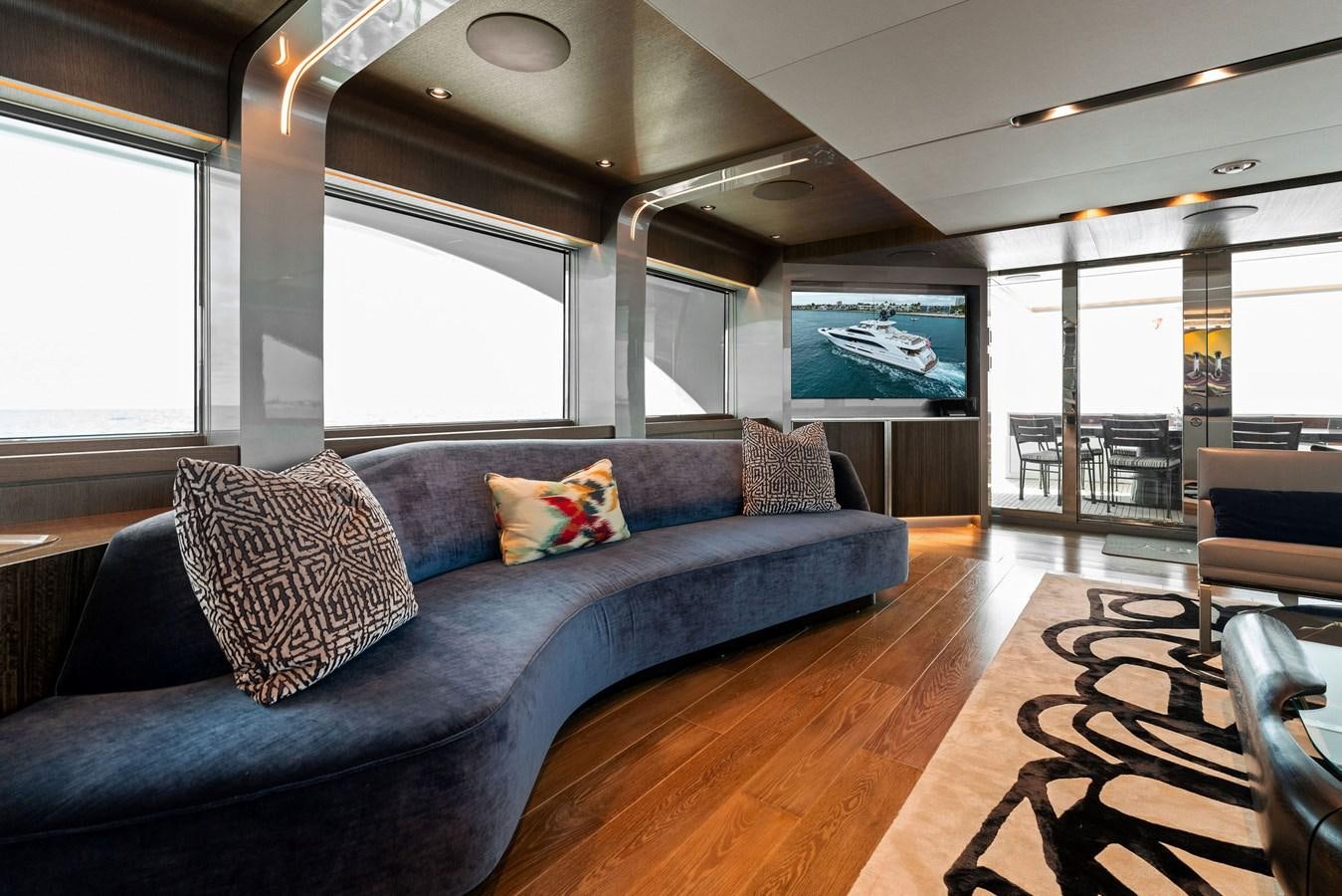 a couch in a room aboard SERENITY Yacht for Sale
