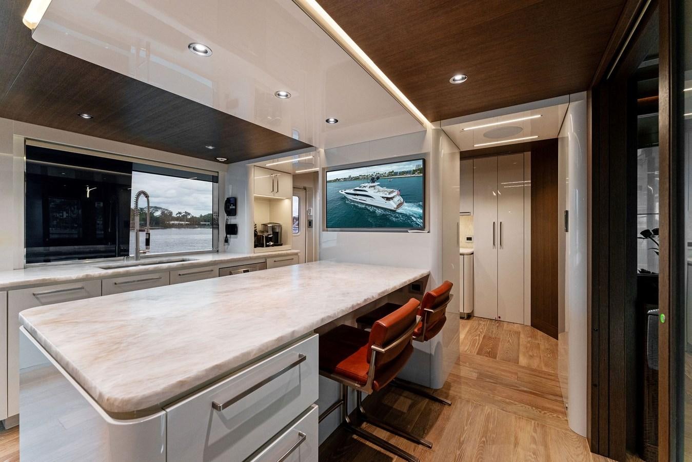 a kitchen with a large island aboard SERENITY Yacht for Sale