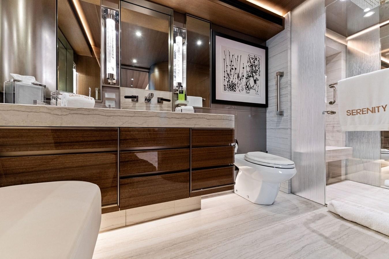 a bathroom with a large mirror aboard SERENITY Yacht for Sale