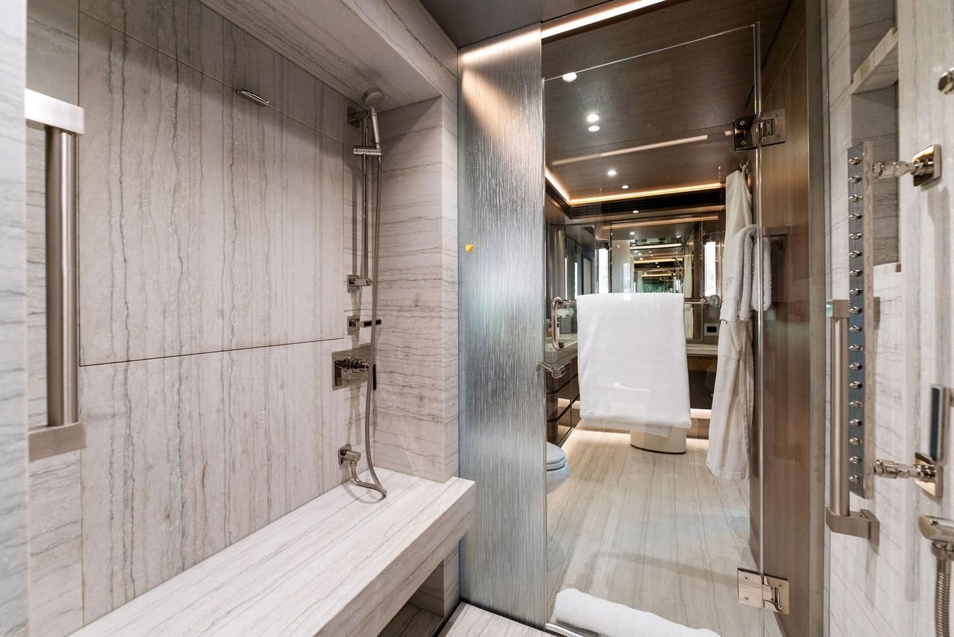 a bathroom with a large mirror aboard SERENITY Yacht for Sale