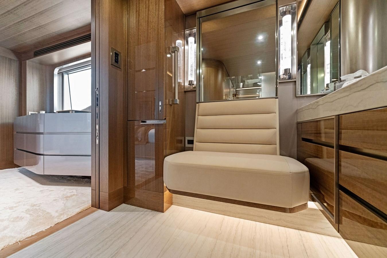 a living room with a wood cabinet aboard SERENITY Yacht for Sale