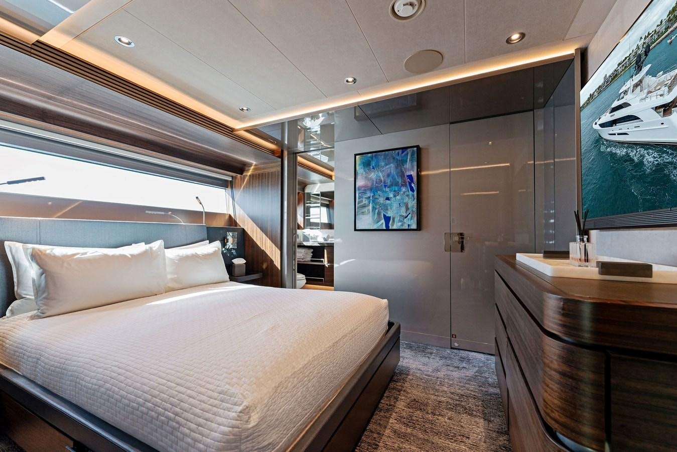 a room with a bed and a television aboard SERENITY Yacht for Sale