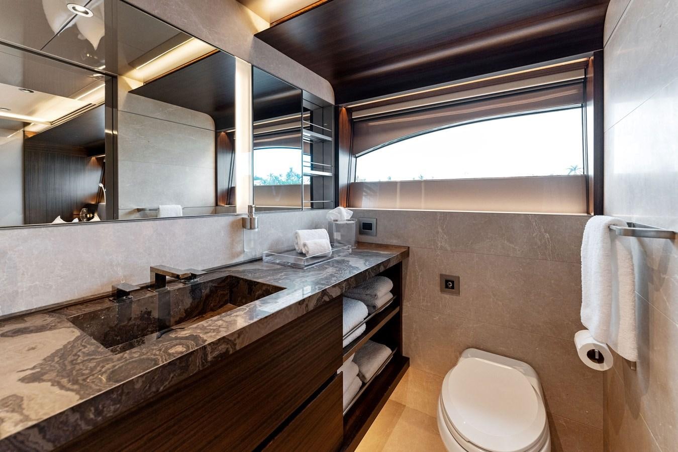a bathroom with a sink and a toilet aboard SERENITY Yacht for Sale
