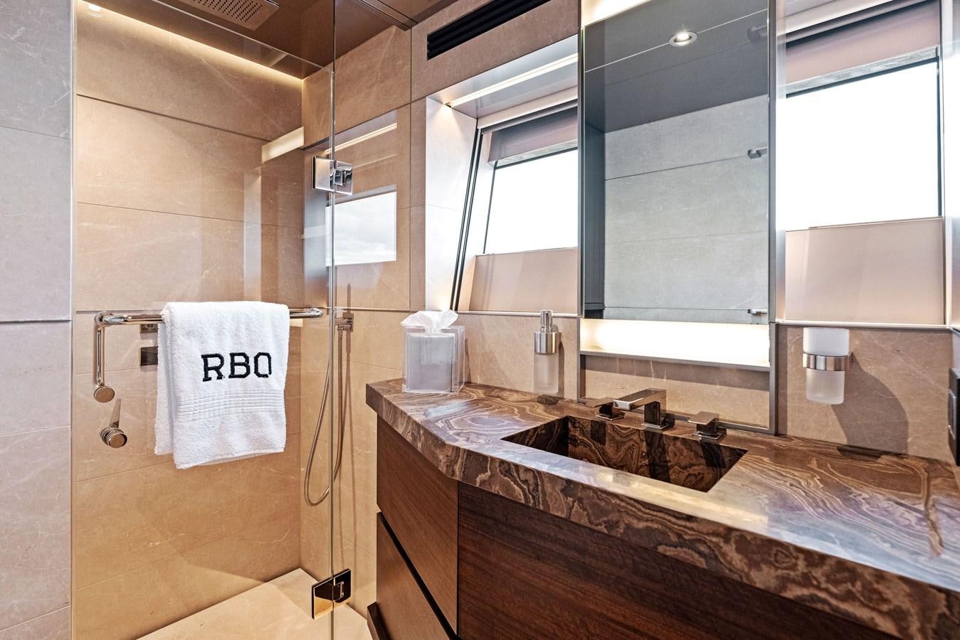 a bathroom with a sink and a mirror aboard SERENITY Yacht for Sale