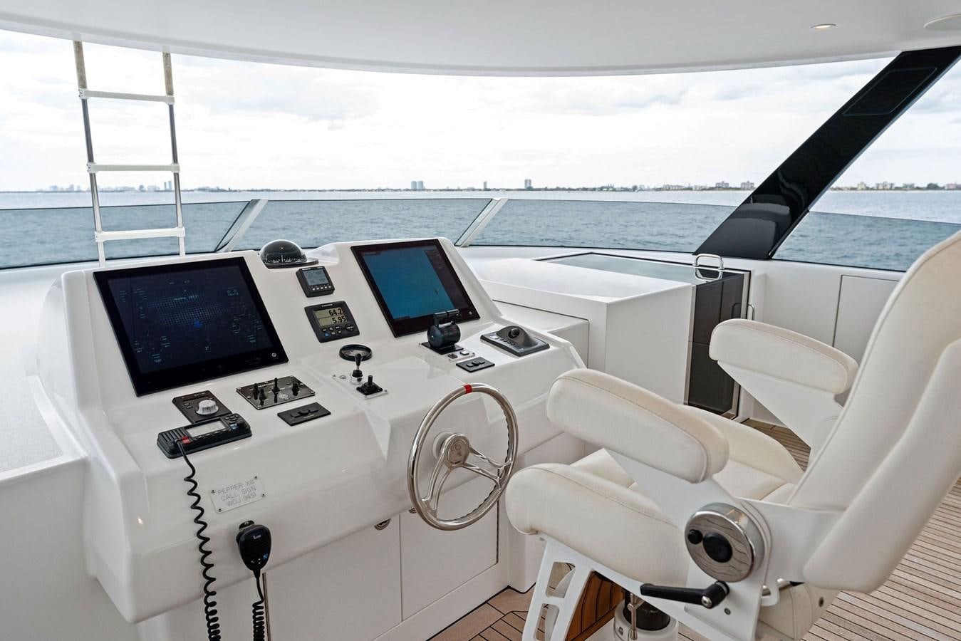 a boat with a screen and a chair on it aboard SERENITY Yacht for Sale