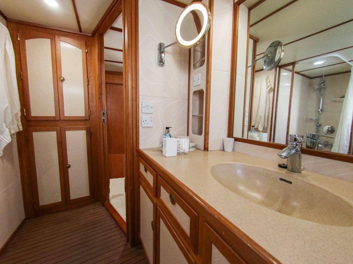 a bathroom with a sink and a mirror aboard LADY ECOSSE Yacht for Sale