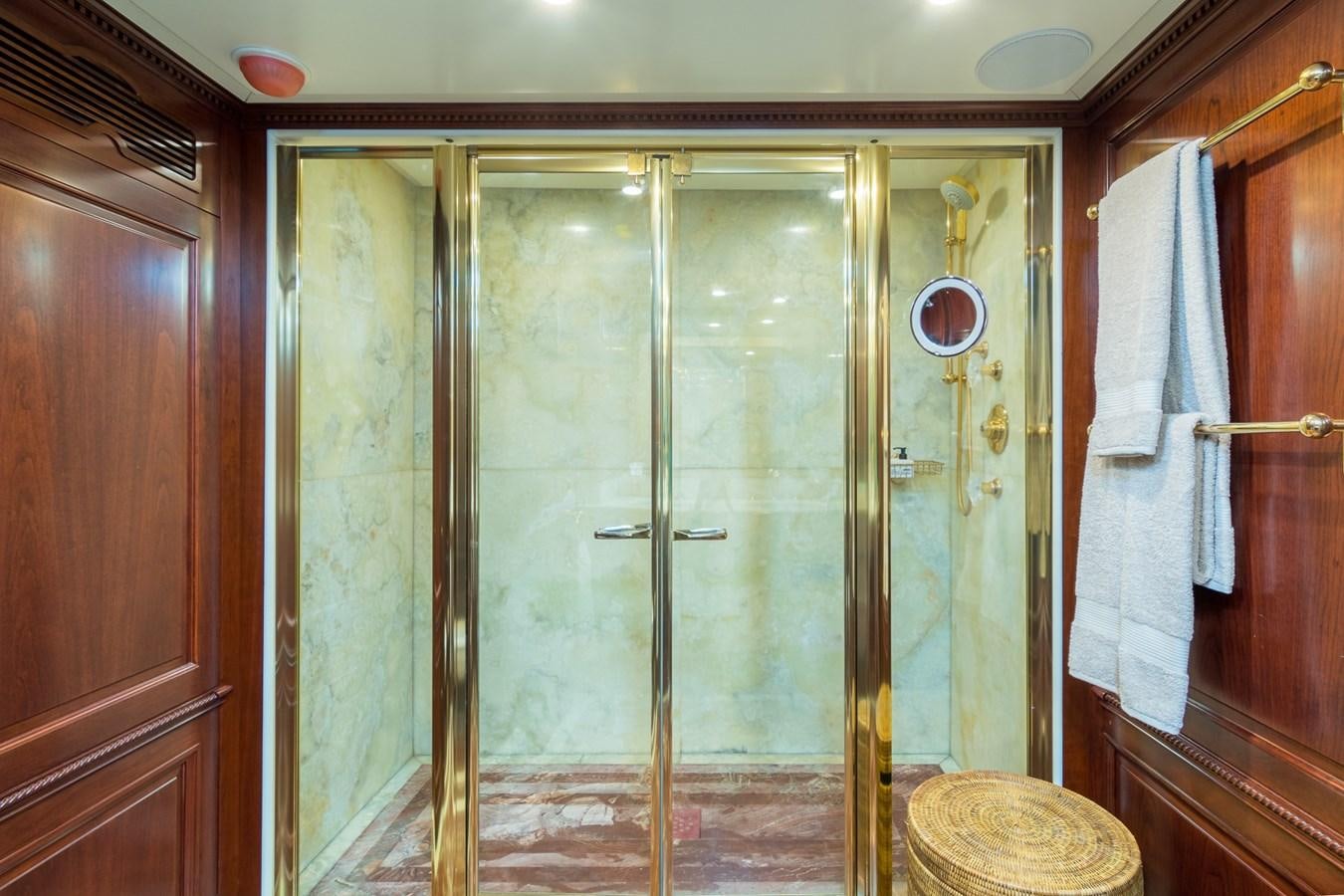 a bathroom with a glass shower aboard ENDLESS SUMMER Yacht for Sale