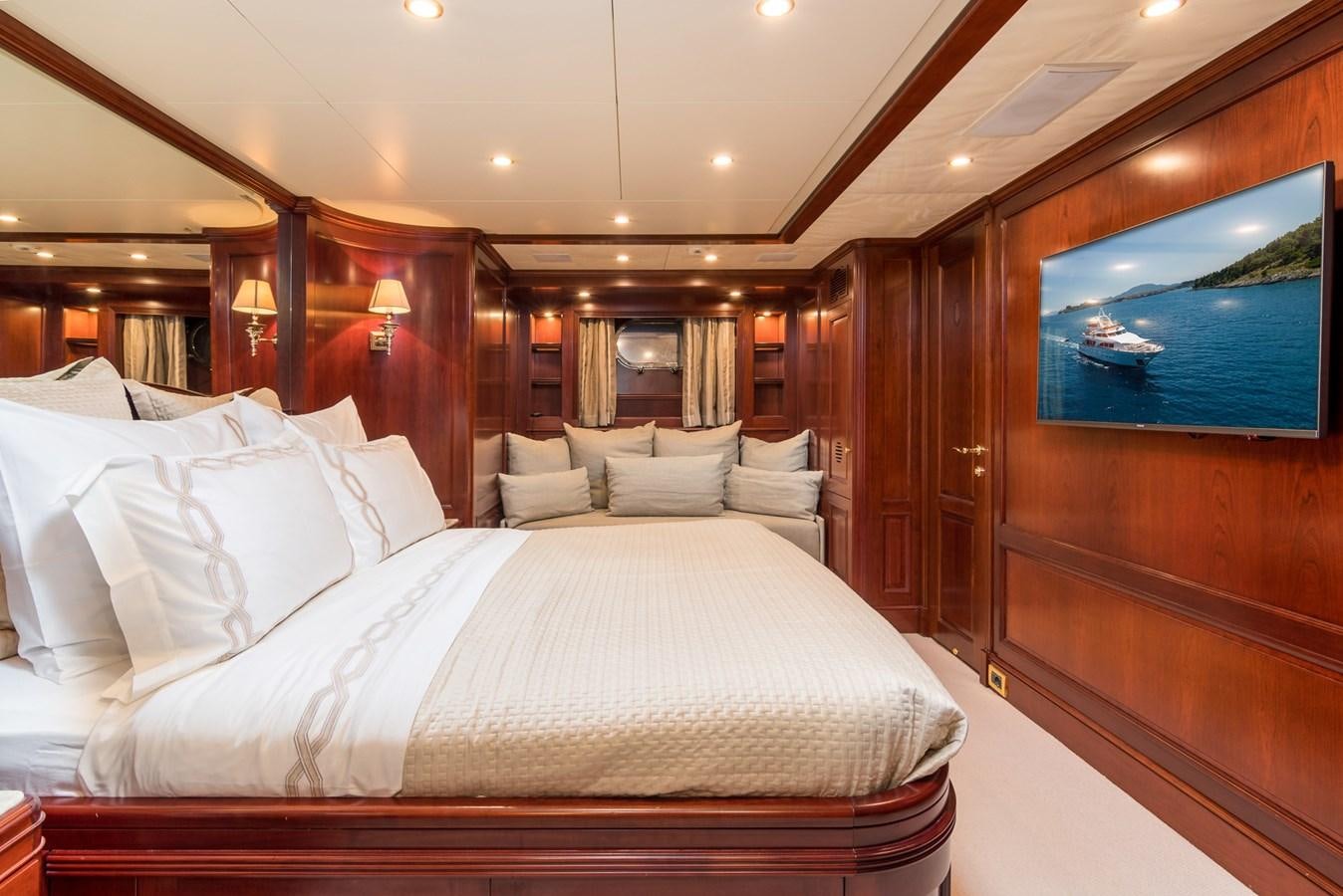 a bed with white sheets aboard ENDLESS SUMMER Yacht for Sale