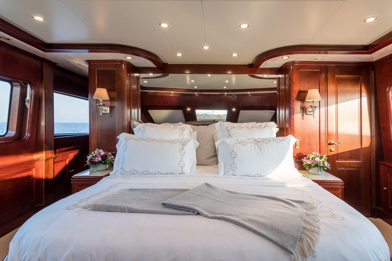 a bed with white sheets and pillows aboard ENDLESS SUMMER Yacht for Sale
