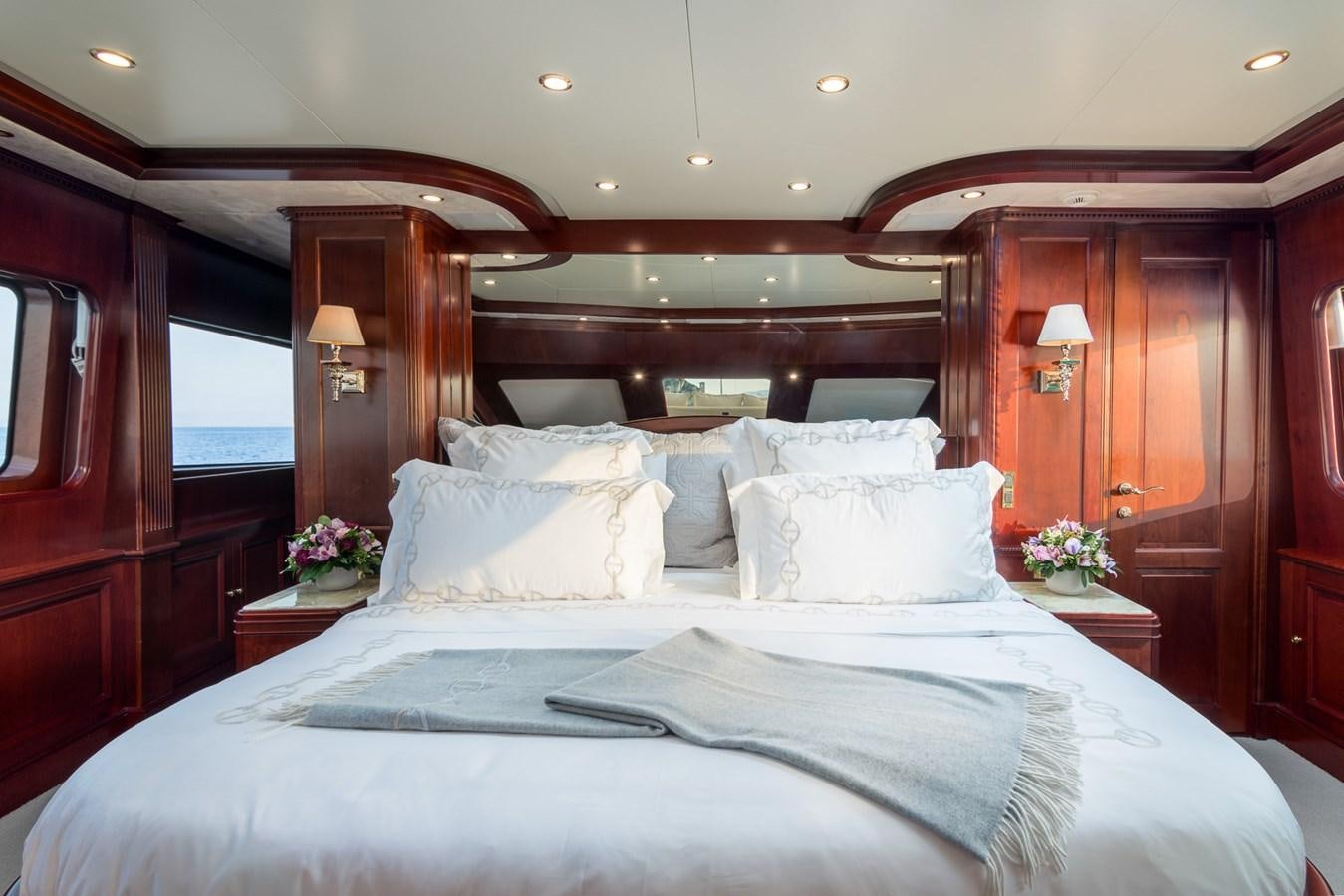 a bed with white sheets and pillows aboard ENDLESS SUMMER Yacht for Sale