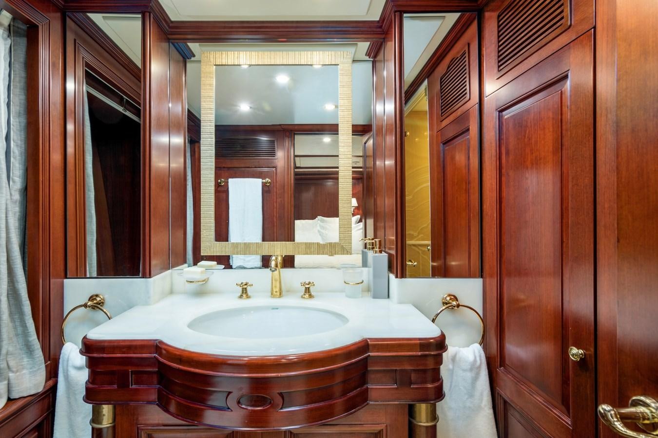 a bathroom with a sink and a mirror aboard ENDLESS SUMMER Yacht for Sale