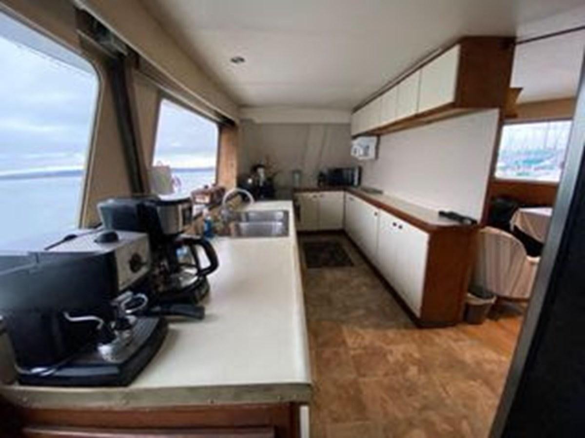 a kitchen with a stove and a sink aboard 1986 CUSTOM SEA TREK PASSENGER VESSEL Yacht for Sale