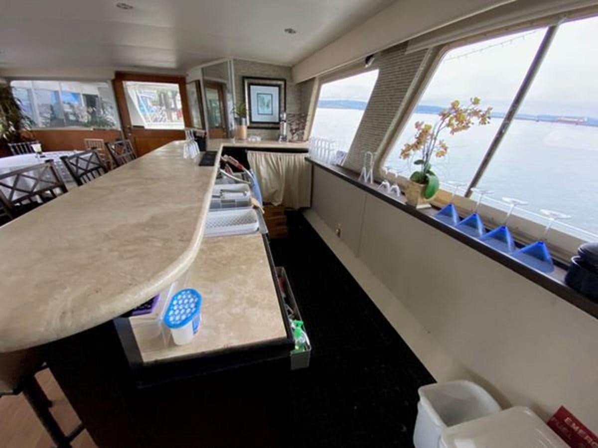 a kitchen with a large island aboard 1986 CUSTOM SEA TREK PASSENGER VESSEL Yacht for Sale