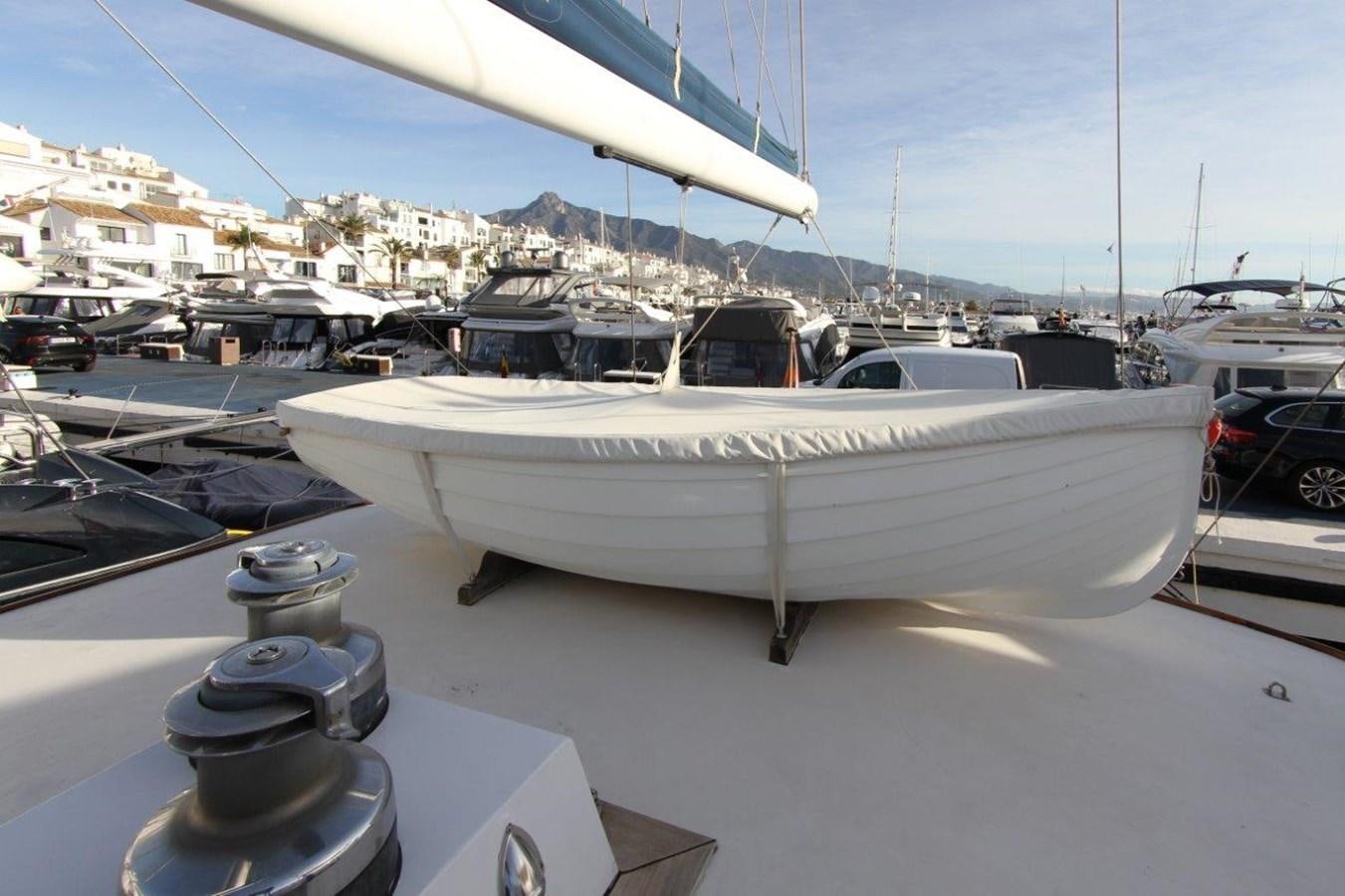 a white boat on a dock aboard COLUMBUS Yacht for Sale