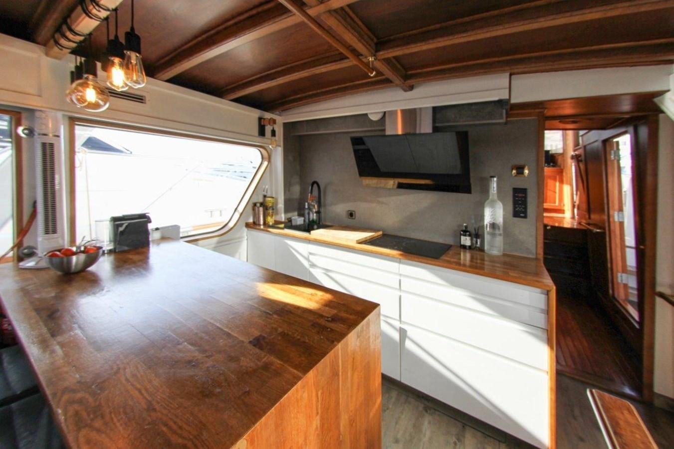 a kitchen with a large island aboard COLUMBUS Yacht for Sale