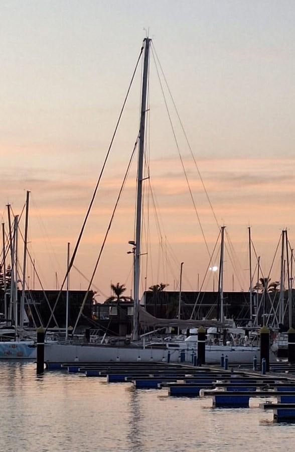 a sailboat docked at a pier aboard IRONBARQUE Yacht for Sale