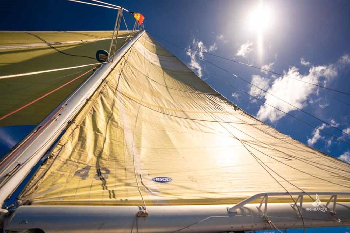 a large sailboat on the water aboard IRONBARQUE Yacht for Sale