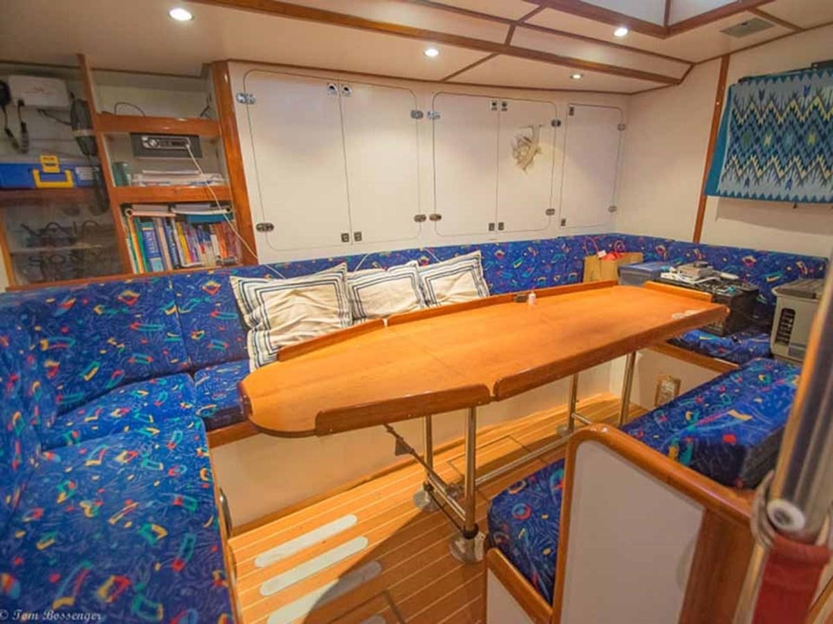 a room with a desk and a bed aboard IRONBARQUE Yacht for Sale