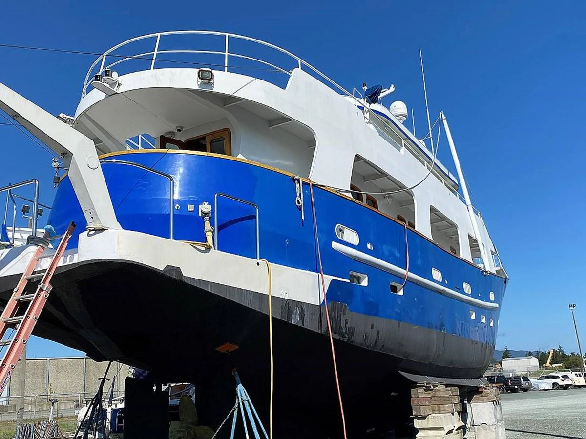 a large white boat aboard BEAR PAW Yacht for Sale